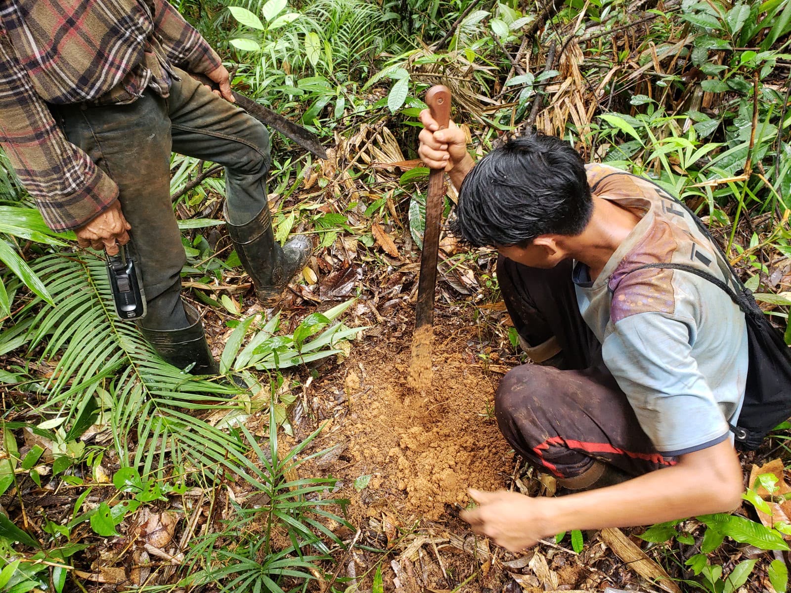 Field team carrying out sampling in the mining area