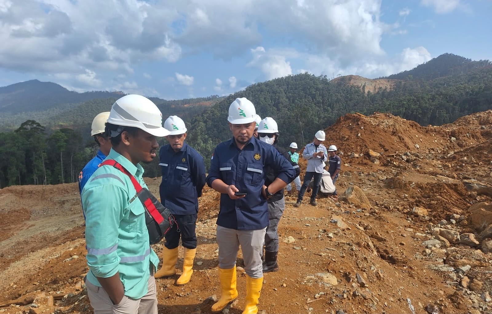 Group wearing hardhats during a visit to the mining site